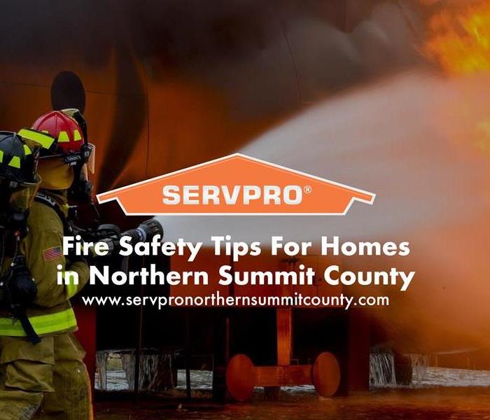 Orange SERVPRO  house logo on image with firefighters putting out a fire. 