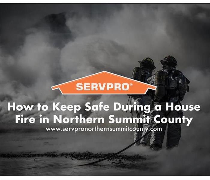 Orange SERVPRO  house logo on image with Firefighters and fire in background